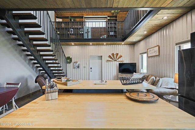 743 Co Rd, M, Tahoka, TX 79373 - living area with stairs, healthy amount of natural light, wood finished floors, wooden ceiling, and recessed lighting