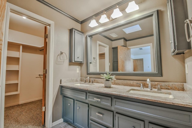 bathroom with vanity and ornamental molding