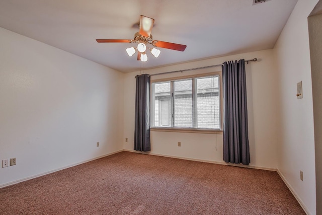 spare room with carpet flooring and ceiling fan