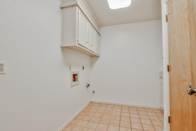 laundry room featuring cabinets, washer hookup, hookup for an electric dryer, and hookup for a gas dryer