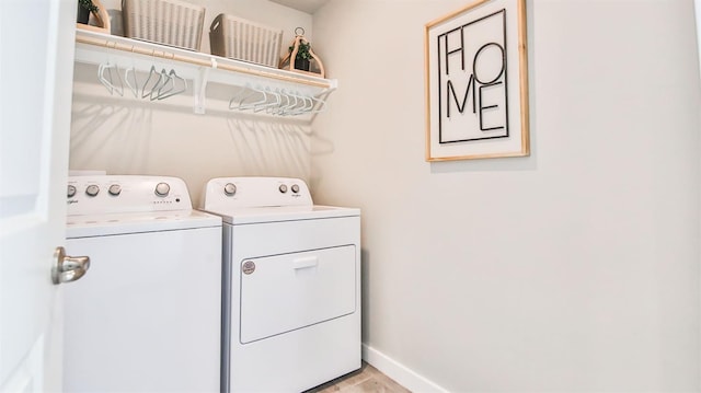 washroom with light wood-type flooring and independent washer and dryer