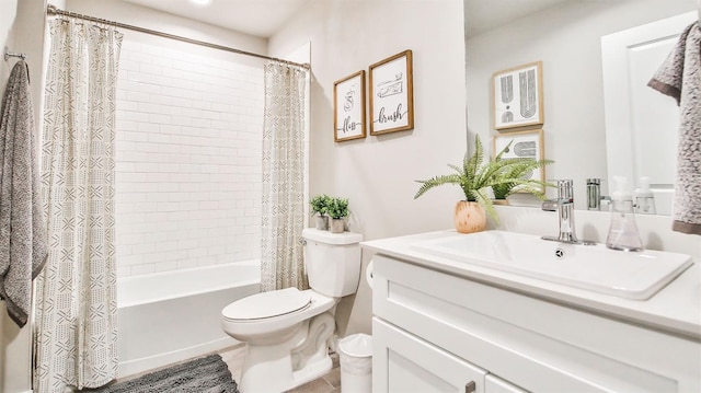 full bathroom featuring tile patterned flooring, shower / bath combo, vanity, and toilet