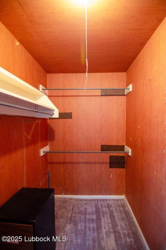 5001 13th St, Lubbock, TX 79416 - walk in closet featuring carpet flooring
