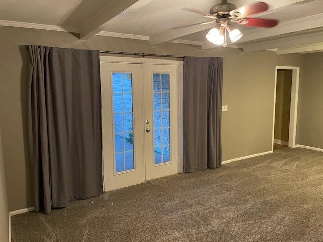 spare room featuring ornamental molding, dark carpet, ceiling fan, beam ceiling, and french doors