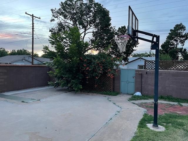 view of patio featuring basketball hoop