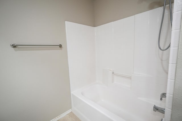 1505 Westminster Ave, Wolfforth, TX 79382 - full bath with shower / bath combination and baseboards