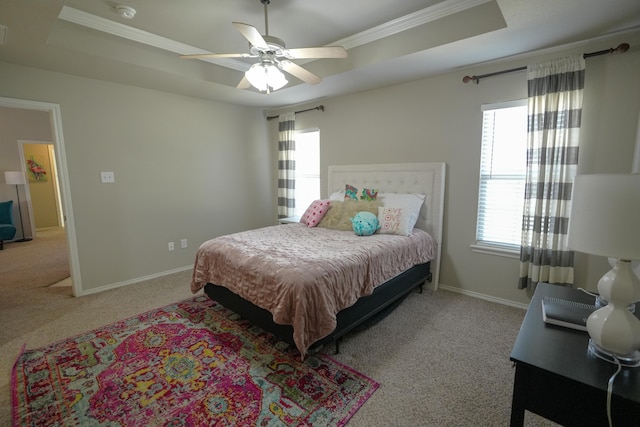 1505 Westminster Ave, Wolfforth, TX 79382 - carpeted bedroom with a tray ceiling, ornamental molding, multiple windows, and ceiling fan