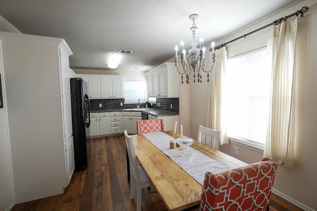 1505 Westminster Ave, Wolfforth, TX 79382 - dining area featuring a chandelier and dark wood-type flooring