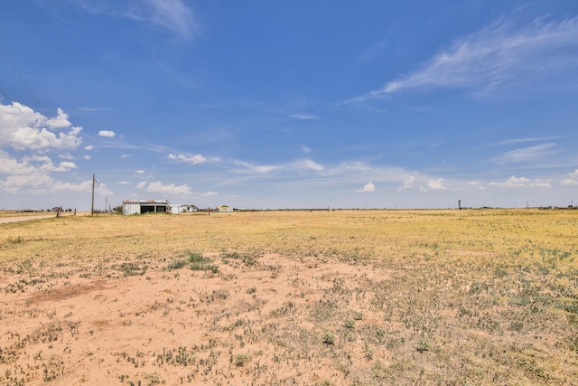 view of yard with a rural view