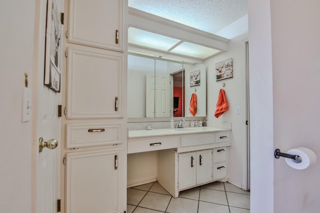 bathroom featuring tile patterned flooring and vanity