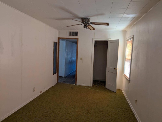 unfurnished bedroom with carpet flooring, ceiling fan, and a closet