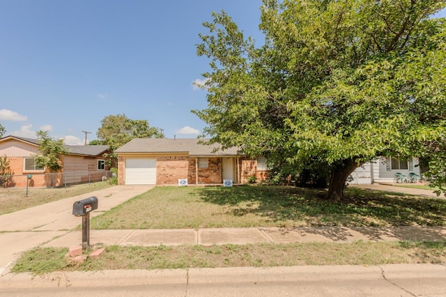 view of front of home featuring a garage and a front lawn