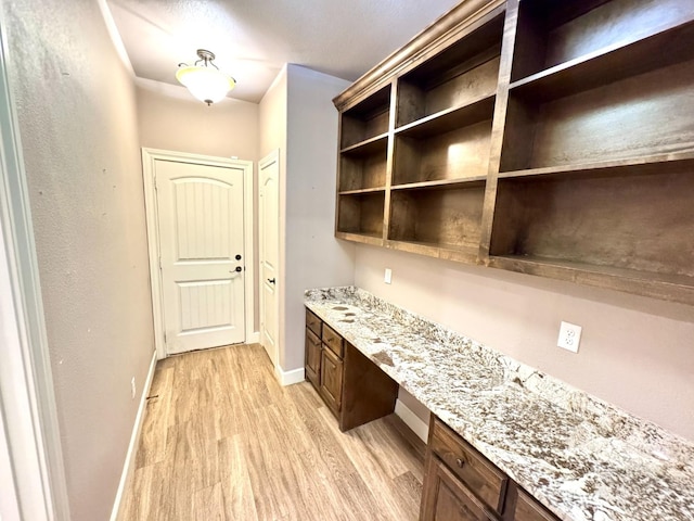 interior space featuring light hardwood / wood-style flooring and built in desk