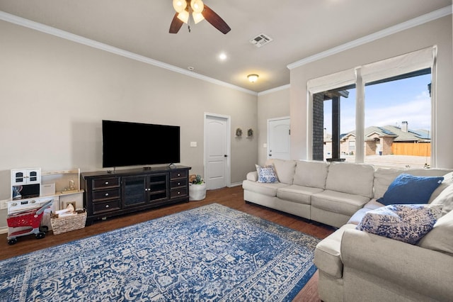 living room with dark hardwood / wood-style flooring, ornamental molding, and ceiling fan