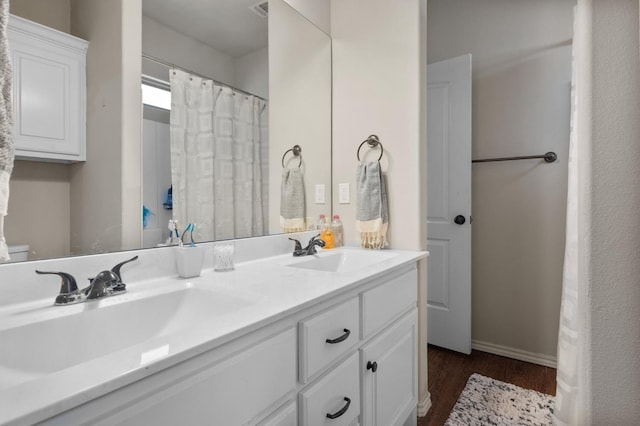 bathroom with wood-type flooring and vanity