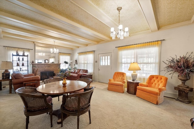 dining room featuring a chandelier, beamed ceiling, and a wealth of natural light