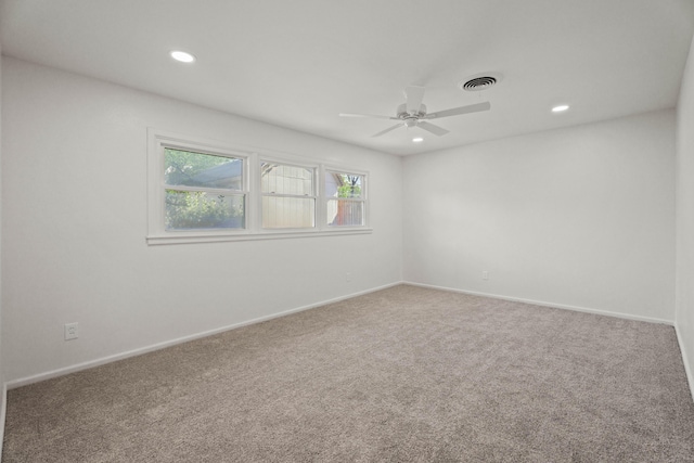 empty room with baseboards, visible vents, recessed lighting, ceiling fan, and carpet floors