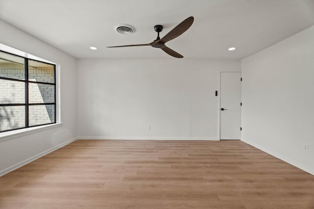 unfurnished room with ceiling fan, light wood finished floors, visible vents, and recessed lighting