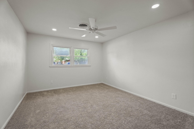 empty room with ceiling fan, carpet flooring, visible vents, and recessed lighting