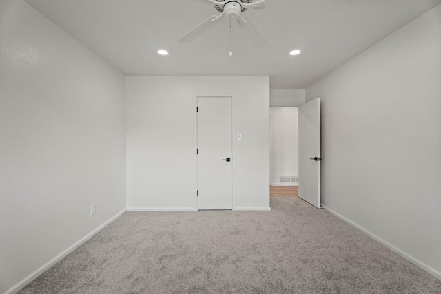 unfurnished bedroom featuring baseboards, carpet flooring, and recessed lighting