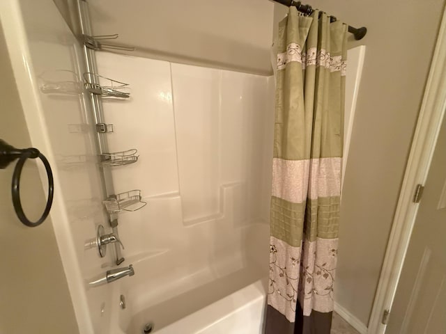 bathroom with shower / tub combo