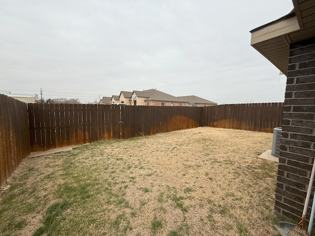 view of yard featuring central air condition unit