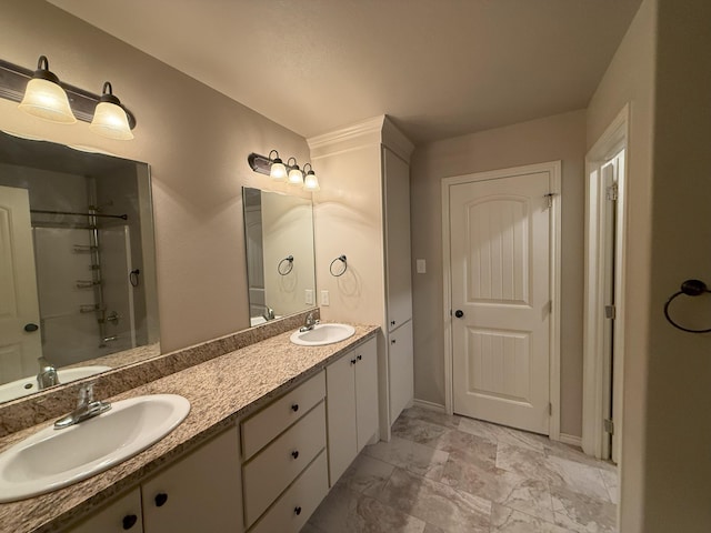 bathroom with vanity and a shower