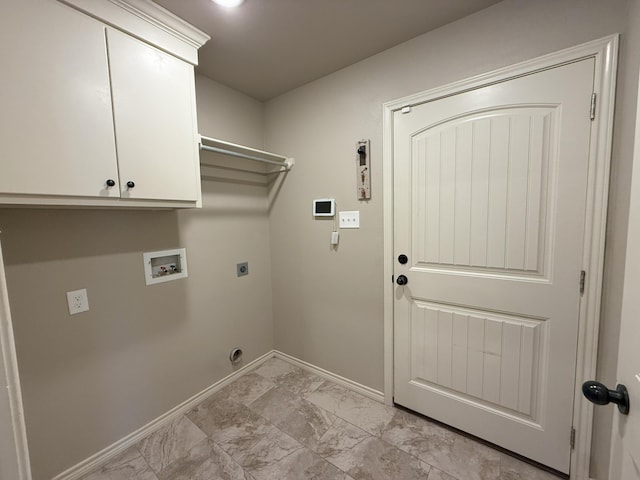 clothes washing area with cabinets, electric dryer hookup, and washer hookup