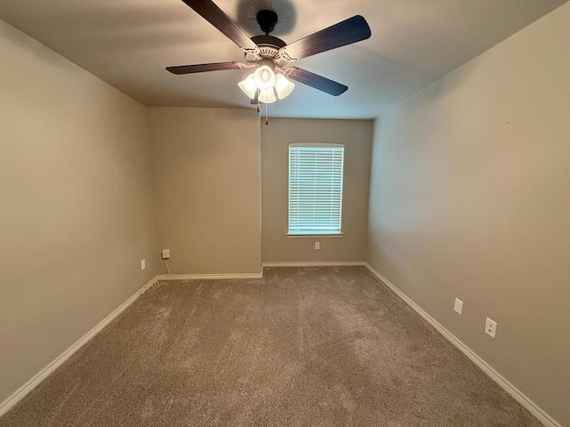 empty room featuring ceiling fan and carpet flooring