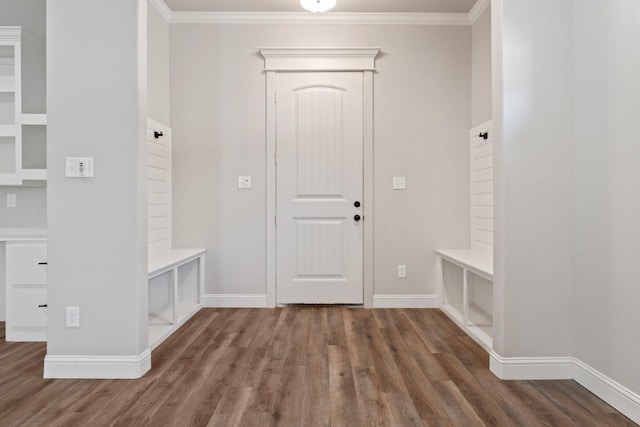 mudroom with ornamental molding and dark hardwood / wood-style floors