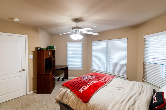 bedroom featuring baseboards, carpet, and ceiling fan