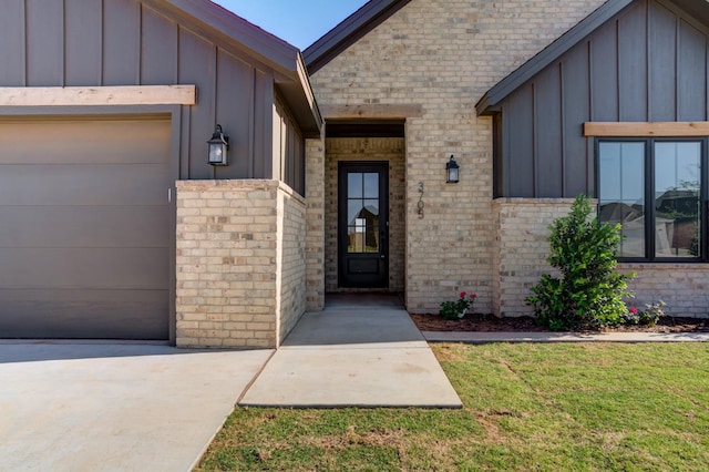 view of exterior entry featuring a yard