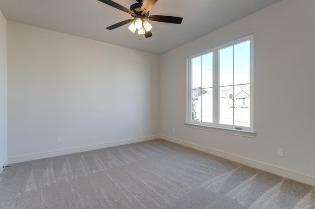 unfurnished room with light carpet and ceiling fan