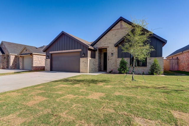 view of front of house with a garage and a front yard