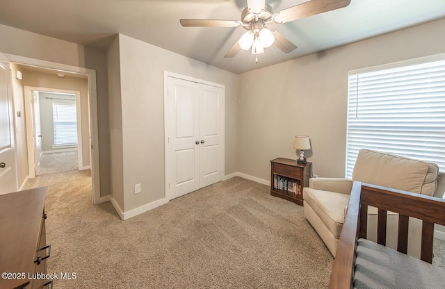 3301 Venita Ave, Lubbock, TX 79407 - bedroom with light carpet, a closet, and ceiling fan