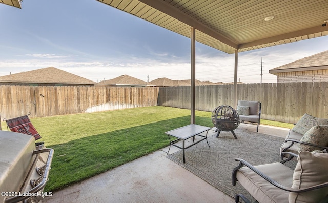 3301 Venita Ave, Lubbock, TX 79407 - fenced backyard featuring a patio area and a fire pit