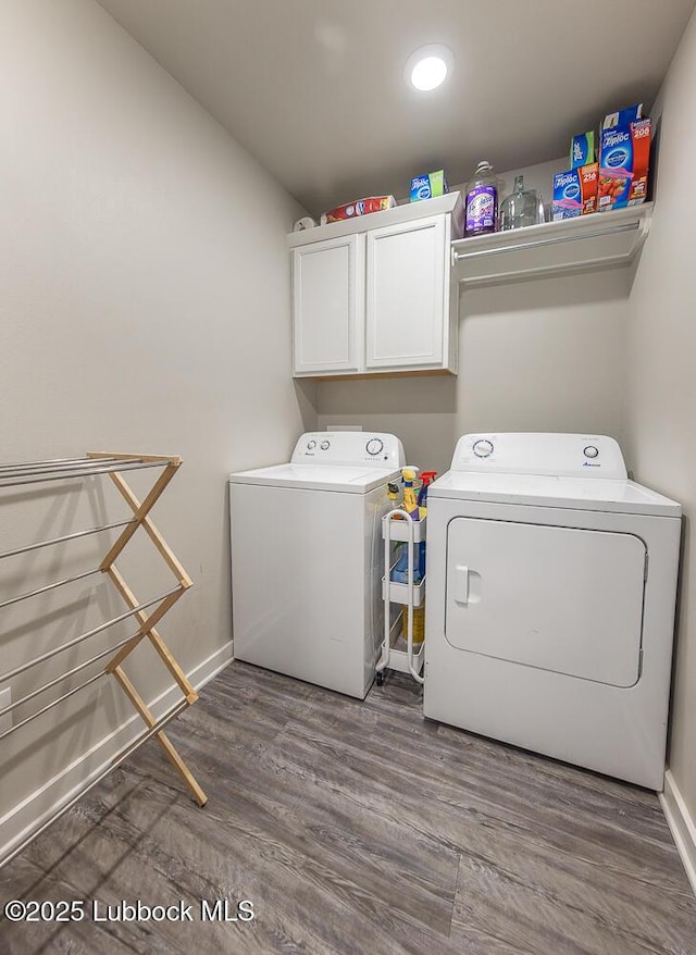 3301 Venita Ave, Lubbock, TX 79407 - laundry area with washing machine and dryer, cabinet space, and wood finished floors