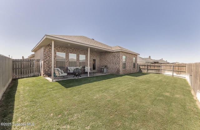 3301 Venita Ave, Lubbock, TX 79407 - back of property with brick siding, a patio, a fenced backyard, and a shingled roof