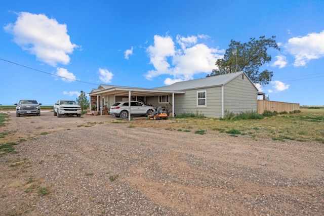 view of front of home featuring a carport