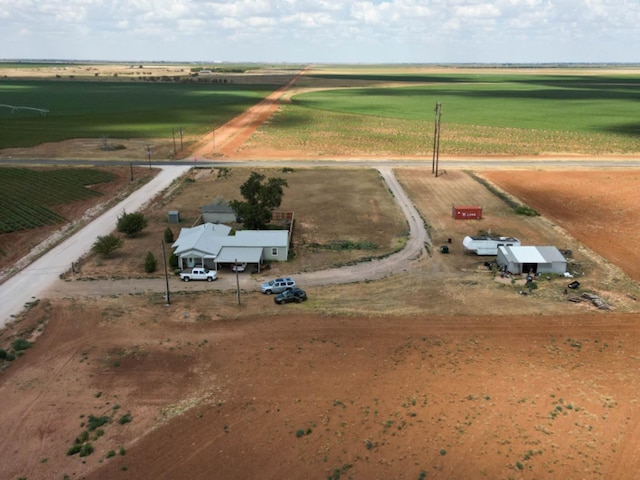 birds eye view of property with a rural view