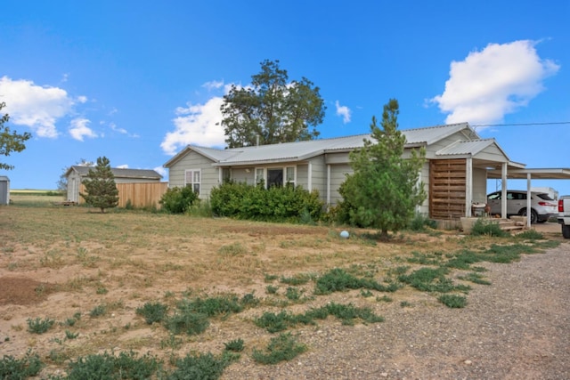 ranch-style home with a carport