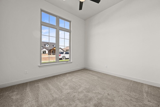 carpeted empty room with ceiling fan