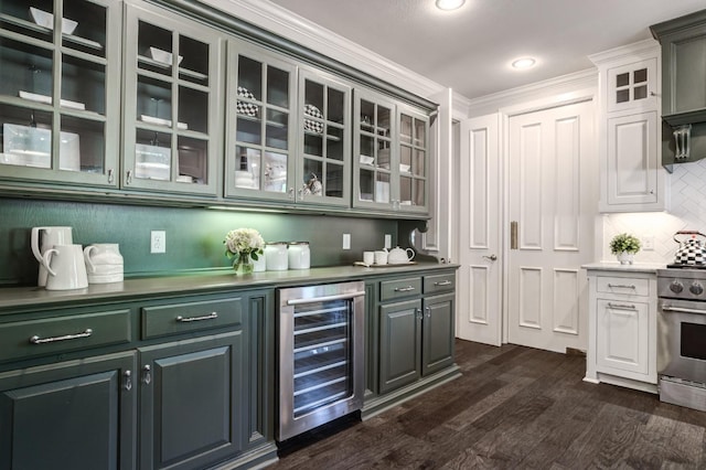 bar featuring wine cooler, stainless steel range, ornamental molding, dark hardwood / wood-style floors, and backsplash