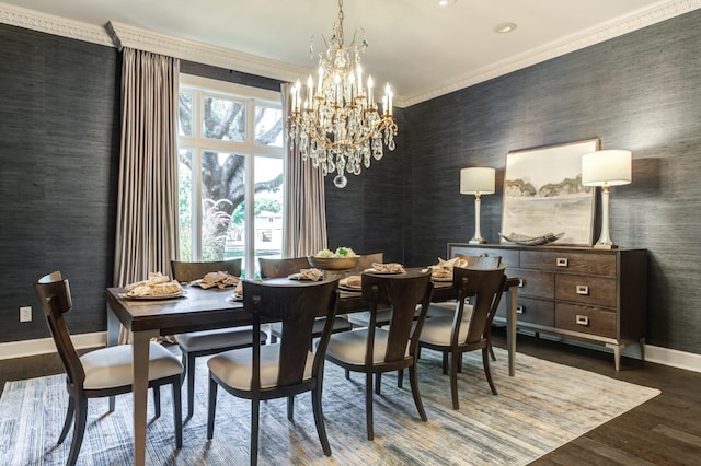 dining space with crown molding, dark hardwood / wood-style flooring, and a chandelier