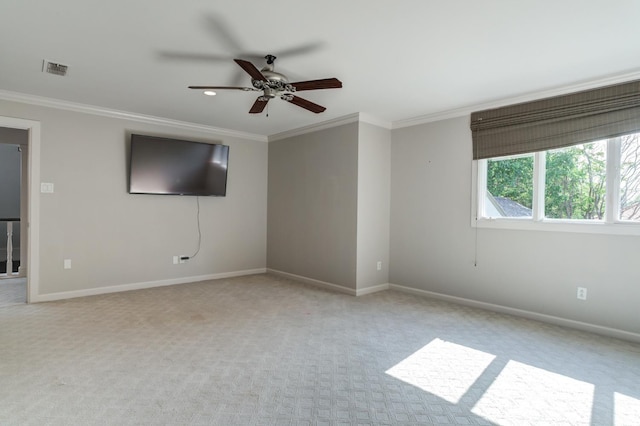 unfurnished room featuring crown molding, ceiling fan, and light carpet