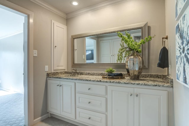 bathroom featuring vanity and crown molding