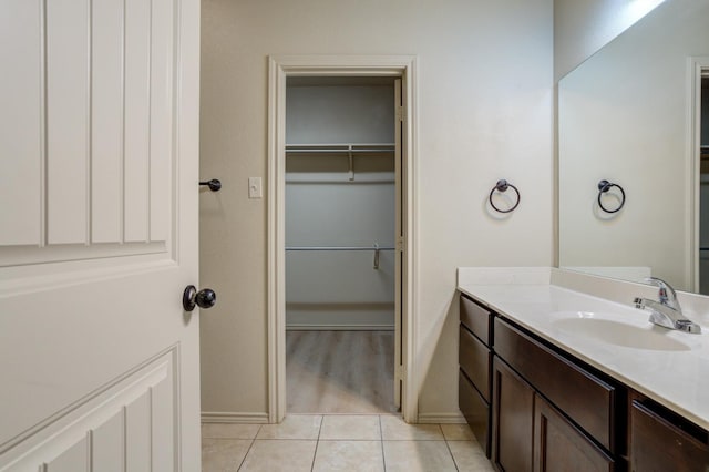 bathroom with tile patterned flooring and vanity