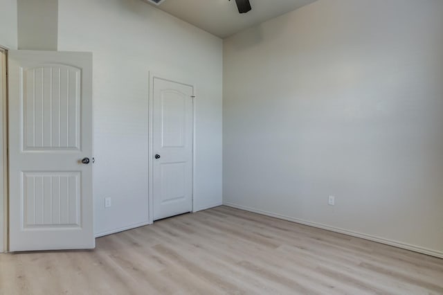 unfurnished bedroom with a closet, ceiling fan, and light hardwood / wood-style floors