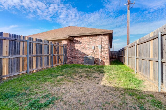 view of yard with central AC