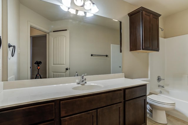 full bathroom featuring vanity, tile patterned floors, toilet, and shower / washtub combination